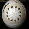 Here the large flower on the reverse side of the egg has had the twelve outside peddles removed as negative space.